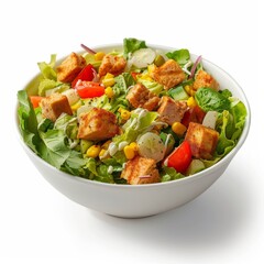 A white bowl filled with salad and covered in tofu