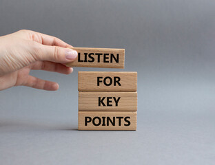 Key points symbol. Wooden blocks with words Listen for Key points. Businessman hand. Beautiful grey...