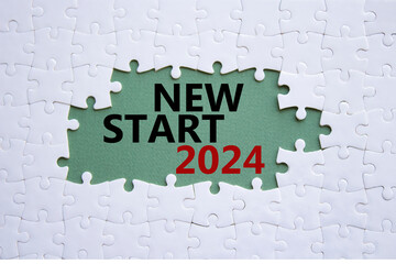 New Start 2024 symbol. Concept words New Start 2024 on white puzzle. Beautiful grey green...