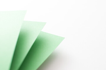 Green and white 3d geometric background with copy space, close up