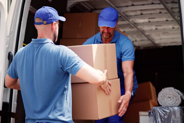 Male Movers In Uniform Loading Delivery