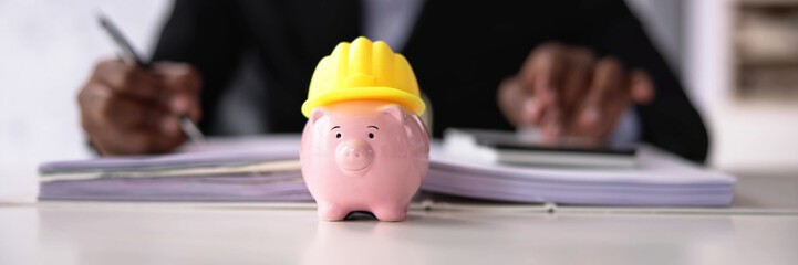 Piggy Bank With Construction Hard Hat