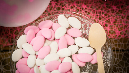Plate of white and pink confetti for wedding or baptism