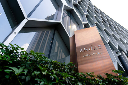SINGAPORE - OCTOBER 08, 2023: Andaz Singapore hotel signboard against the building's honeycomb exterior design.