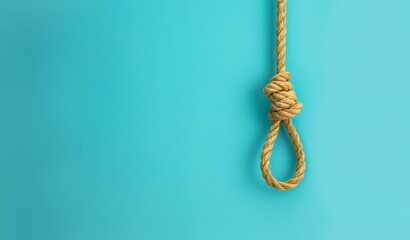un nœud coulant de pendu avec une corde sur un fond bleu