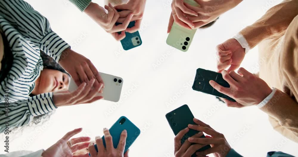 Poster Business people, hands and networking with phone below for communication, data share or sync on a white background. Low angle or closeup of young employees on mobile smartphone, social media or app