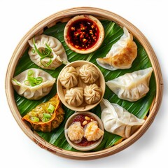 Chinese Dim Sum Set, Various Gyoza, Jiaozi or Momo on Banana Leaves, Spicy Sauces Top View