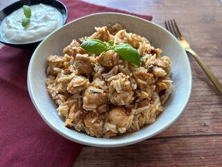 Traditional Austrian specialty, rice and chicken meat dish. Served with sour cream dip.