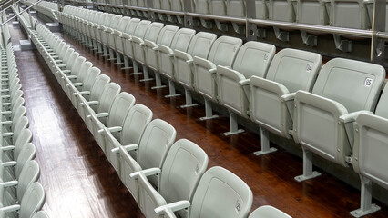 seats of tribune on sport stadium. empty outdoor arena. concept of fans. chairs for audience.
