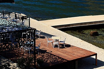 Open veranda of the restaurant on the shore of the Bay of Kotor of the Adriatic Sea
