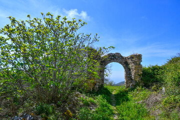 Fototapeta na wymiar The ruins of an ancient abbey in the mountains of Campania in Italy.