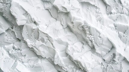 A close up of a white, rough, textured surface.
