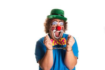 Evil clown from horror movies posing on a white background.