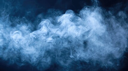 Fototapeta premium Swirling blue smoke creating a textured pattern against a black background