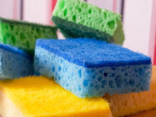 Textured Sponge Assortment. Colorful sponges with porous texture, close-up. Uses for Hygiene...