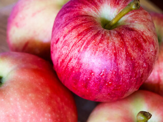 Fresh Apples on Market. Red apples with natural imperfections, indicating freshness.