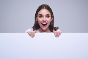 Portrait of woman holding a blank banner. Advertising banner sign. Woman hold empty blank billboard...