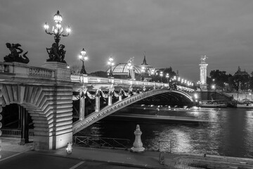 Pont Alexandre III illuminated in the late afternoon. Paris, France. Black and white image.