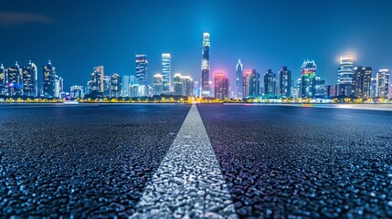 Asphalt road and city skyline with modern building at night in Suzhou, China