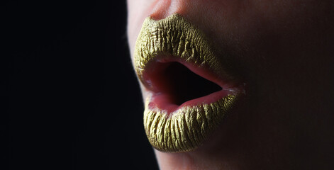 Surprised mouth. Gold lips, golden lipgloss on sexy lips, metallic mouth. Beauty woman mouth. Sexy...