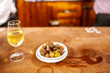 Sherry Glass and Olive Plate in Seville Tavern
