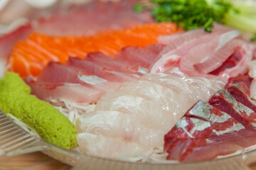 The sashimi of yellowtail and salmon on the dish