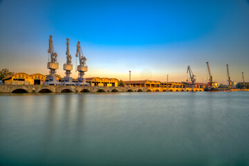 Single jib portal cranes, facilities of the river port of Seville, Spain.