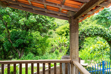 Fototapeta premium Farm balcony overlooking the forest. Trees.