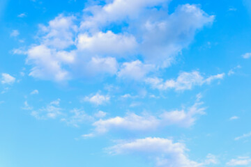 Blue sky background with white clouds in summer day.
