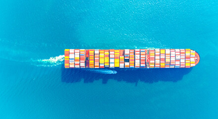Top view Container ship full capacity approaching the port by a tugboat occupying the port International Container ship loading, unloading at sea port, Freight Transportation, Shipping, 