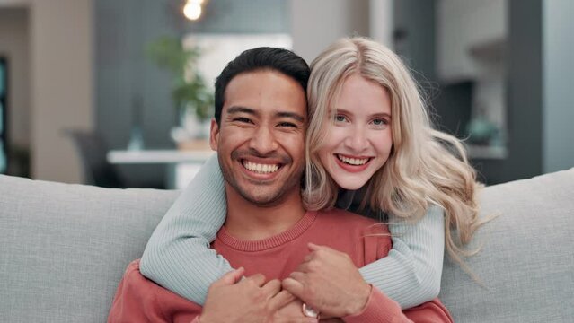 Couple, home and happy with hug in sofa for love, care and support with bonding and relax. Relationship, people and smile in living room on couch with joy, fun and laugh as soulmate on day off