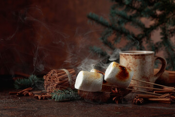 Toasted marshmallows on an old brown table.