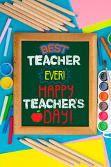 Childish lettering for Teachers' Day on chalkboard. Appreciation of teachers top view flat lay...