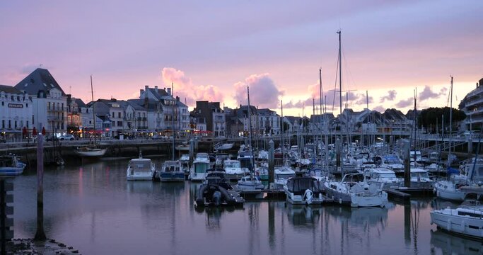 A beautiful dusk on a small French harbor. Le Pouliguen, France - May 03, 2024