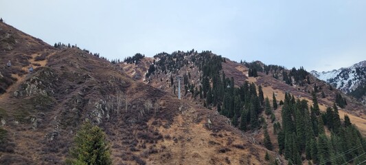 beautiful picturesque view high in the mountains, early spring, fallen covers,