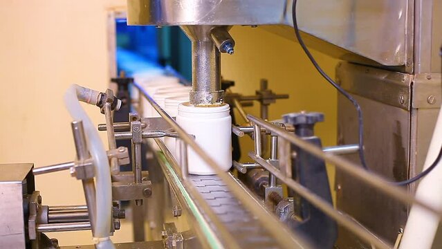 protein powder making process. protein powder filling and packing in plastic container boxes. pharma grade production factory. gmp iso certified manufacturing. powder filling process. making process.	