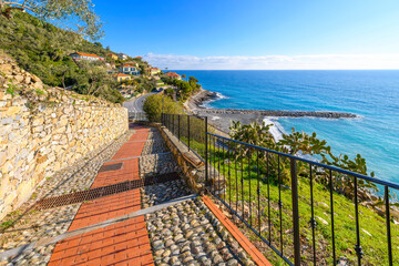 The steep pedestrian walkway from the coast to the hilltop medieval town of Cervo, Italy, in the...