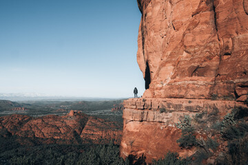 A woman is standing over red rocks landscape, Sedona Arizona USA on 05/01/2024