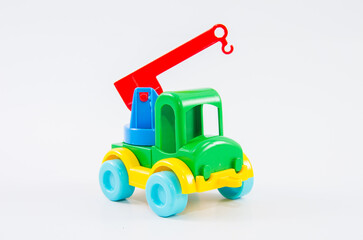 Plastic toy multi-colored truck on a white background.