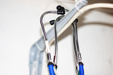 Close up of stethoscope with green and blue handles