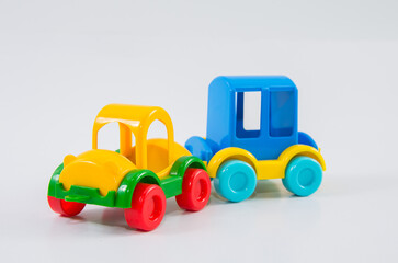 Plastic toy car with travel trailer.