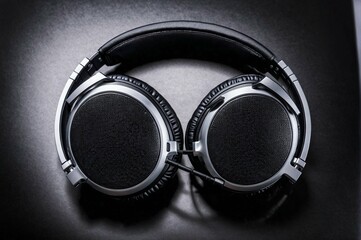 A pair of headphones with a black and silver design