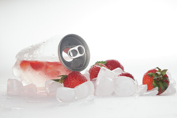 А transparent jar with a refreshing strawberry drink. Can with drink and ice
