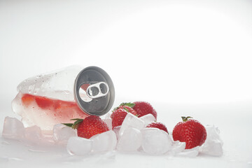 А transparent jar with a refreshing strawberry drink. Can with drink and ice

