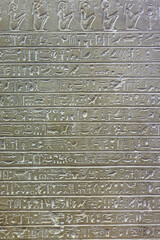 A weathered wall adorned with intricate, mysterious writings in various languages, revealing hidden stories and secrets waiting to be deciphered