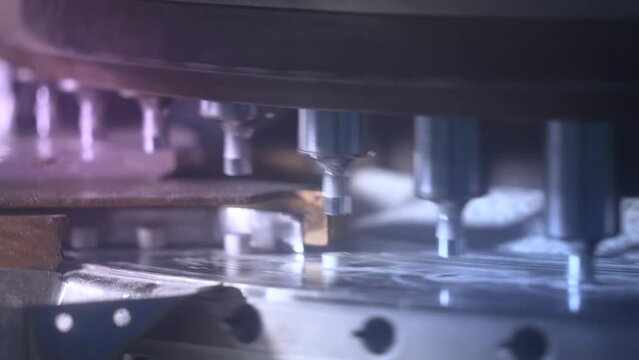tablets in a machine. medicine making machine close up. compression machine shaping tablets. equipment forming tablets from powder. automatic pharma machine in pharmaceutical manufacturing factory.	