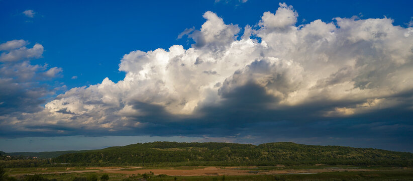 white storm clouds above unji hill.