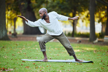 Man, yoga and action in park for exercise, balance and healing outdoor for health with fitness in...