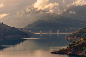 Viaduct over the Rules dam, road that connects Granada with the Tropical coast, landscape of water,...