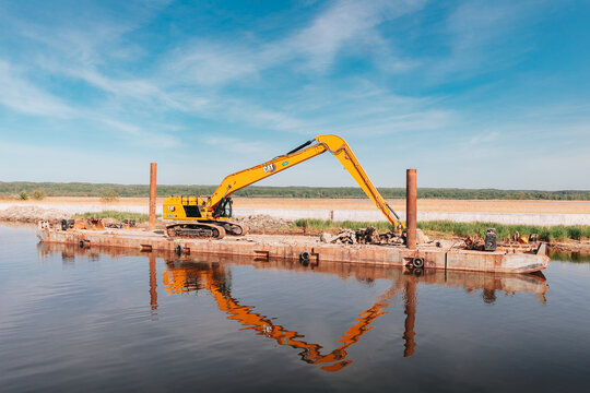 POLAND - 03 May 2024: riverbed dredging machine on a floating platform. Elbląg Canal. 